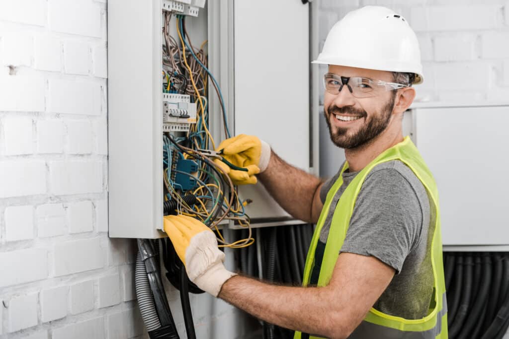 Electrician working on an electrical panel