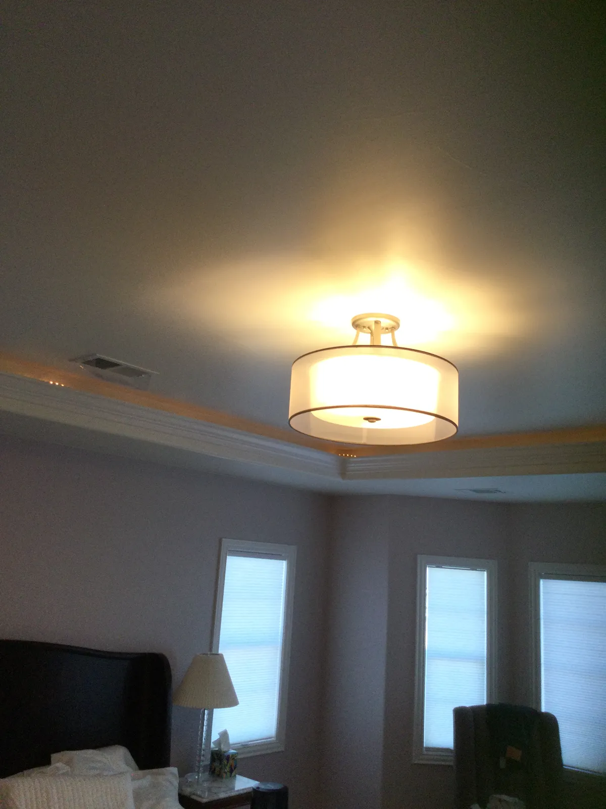 Drum-shade ceiling light in a bedroom, Northern Colorado
