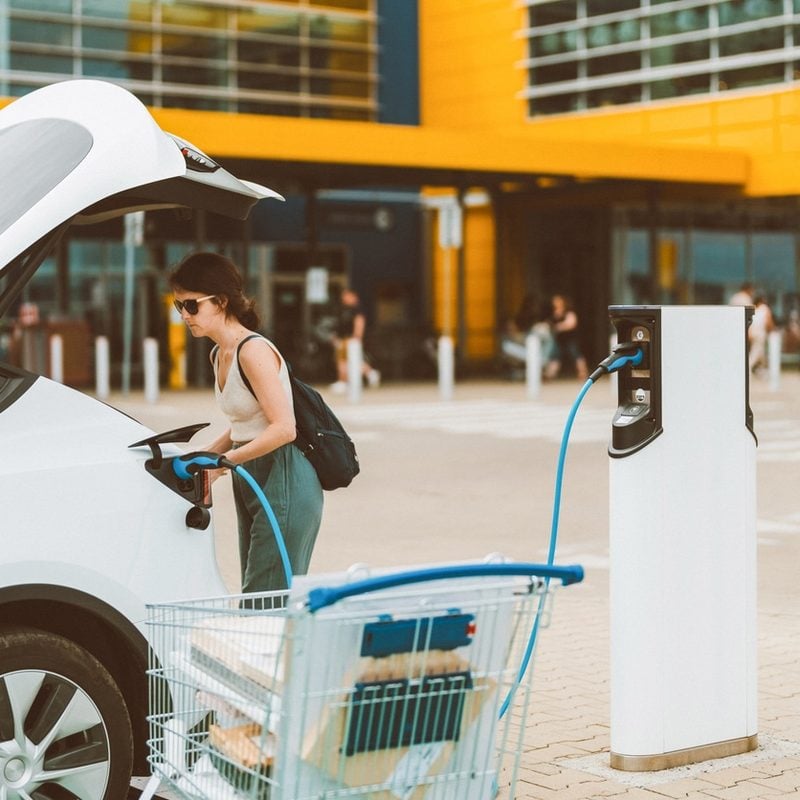 Electric vehicle charging at a commercial charging station