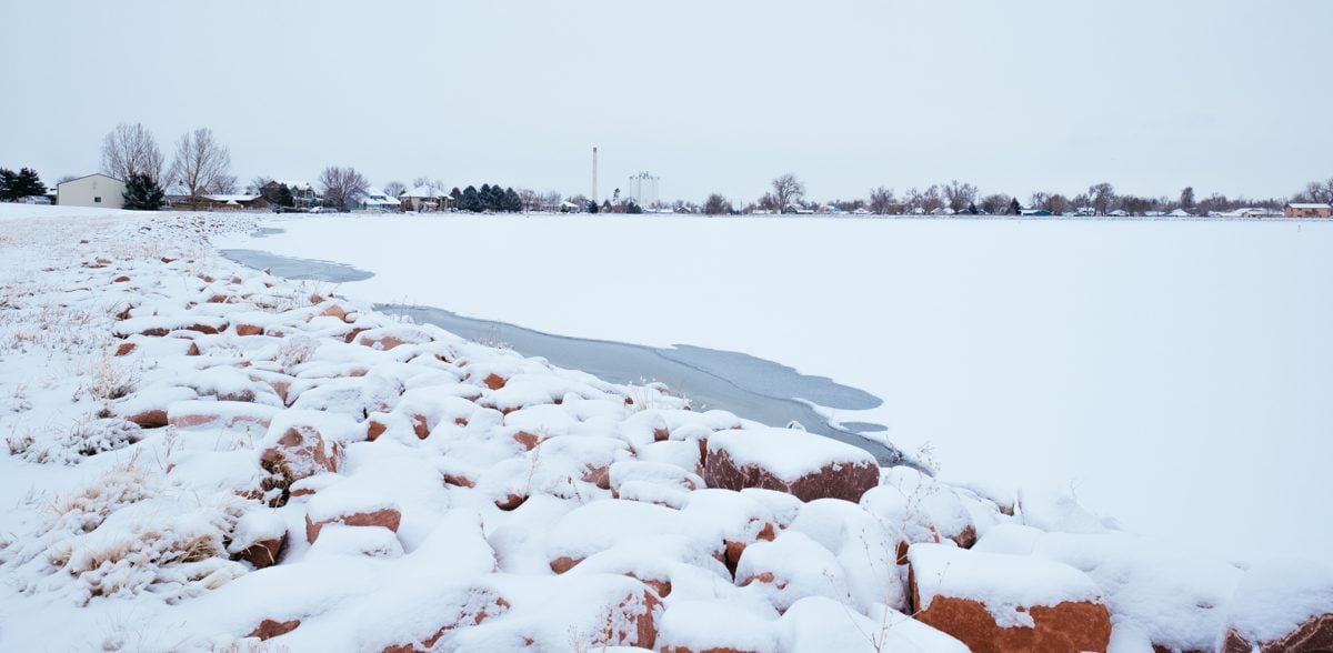 Windsor, Colorado skyline across Windsor Lake in winter