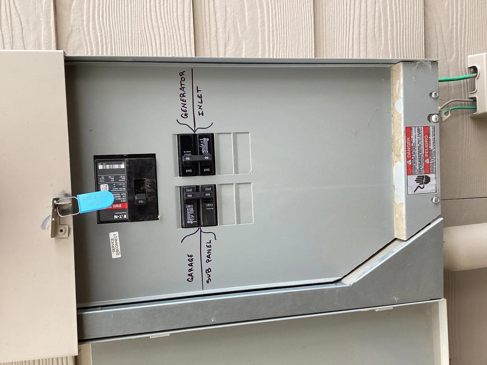 Generator transfer switch mounted on an exterior wall, Northern Colorado